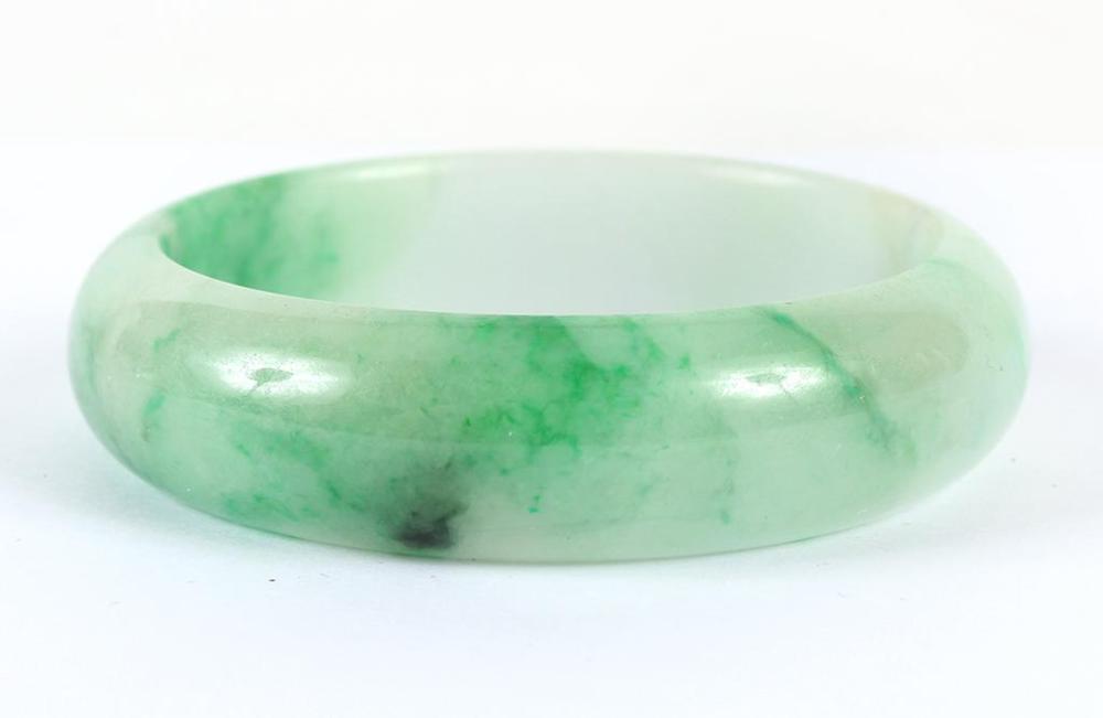 SPINACH GREEN ICY JADEITE BANGLE - The highly polished...