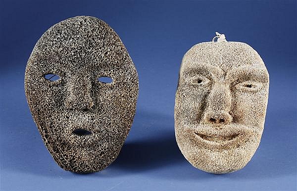 TWO CARVED FOSSILIZED WHALEBONE MASKS - Inuit People