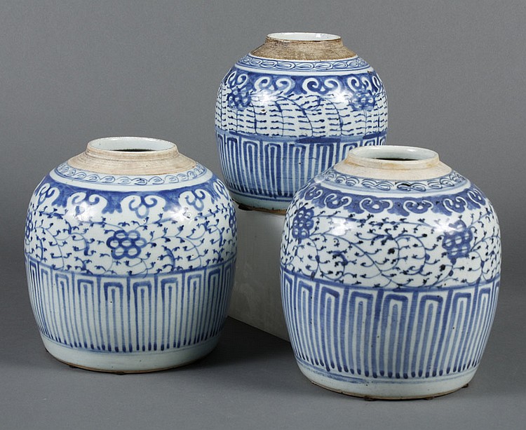 THREE CHINESE CERAMIC BLUE AND WHITE ROUND STORAGE JARS...