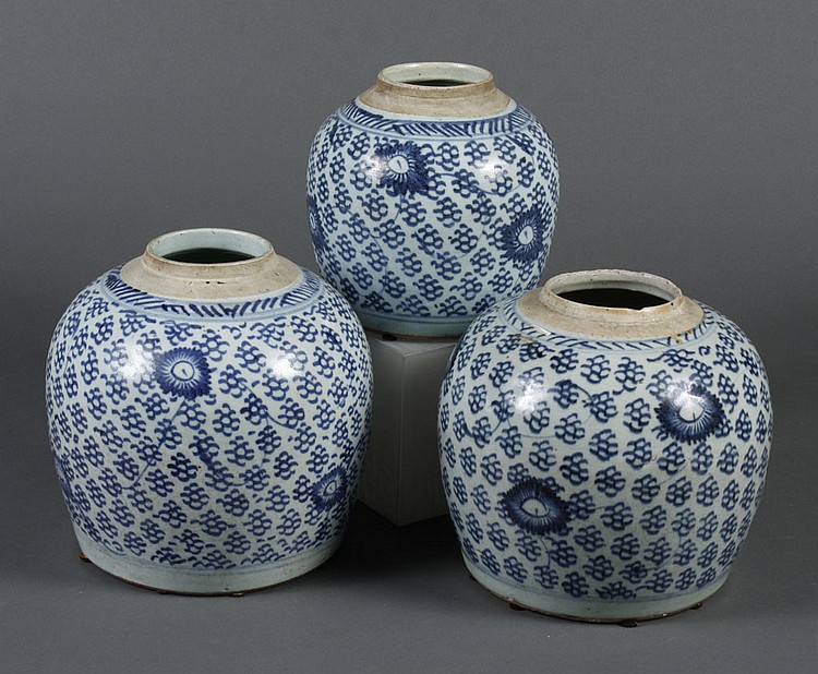 THREE CHINESE CERAMIC BLUE AND WHITE ROUND STORAGE JARS...