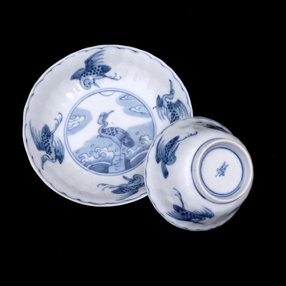 A CUP AND SAUCER
