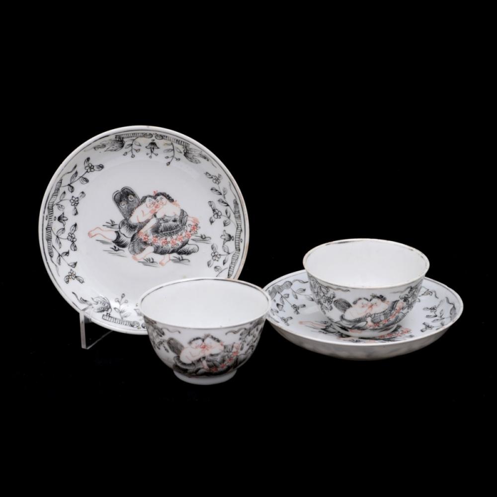A PAIR OF CUPS AND SAUCERS