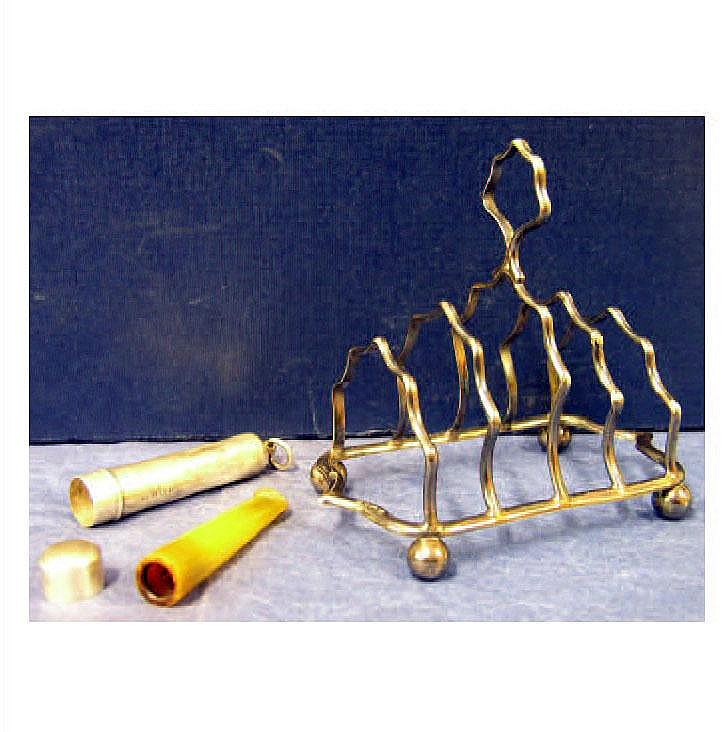A hallmarked silver toast rack and a hallmarked