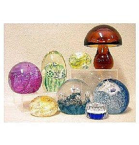 A collection of glass paperweights: millefiori, Caithness, amber mushroom