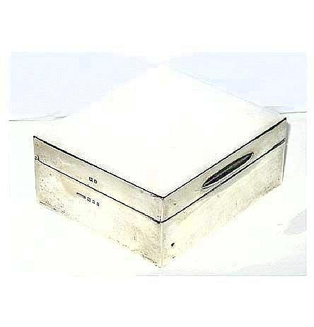 A hallmarked plain rectangular silver cigarette box, with cedar linings