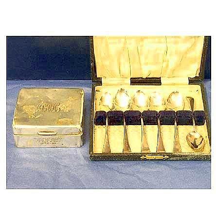 A hallmarked silver cigarette box with cedar lining - Birmingham1924;