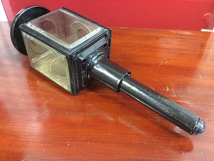An nineteenth century carriage lamp, with reflecting interior under