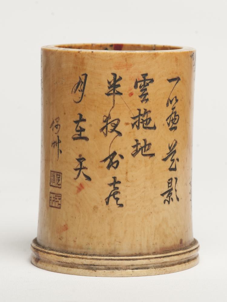 AN IVORY-CARVED BRUSH POT