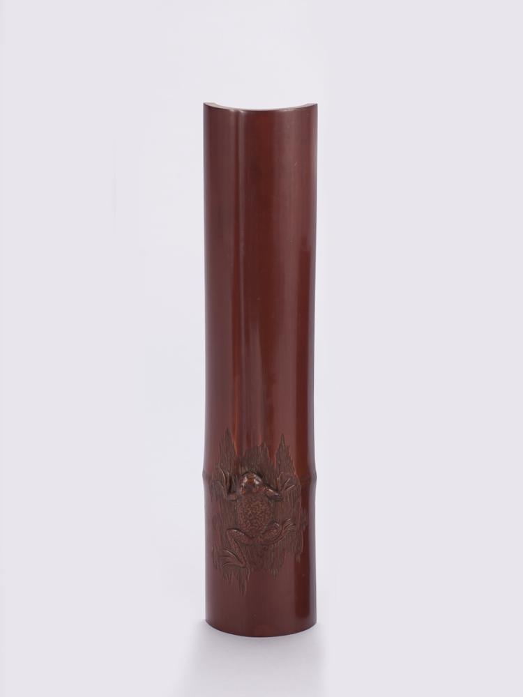 A BAMBOO-CARVED WRIST REST