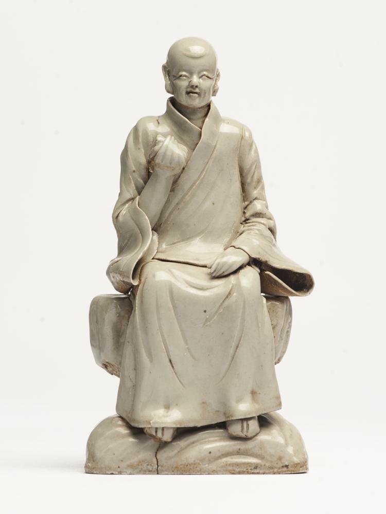 A PORCELAIN STATUE