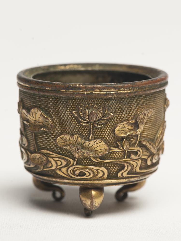 A GILT-BRONZE TRIPOD CENSER