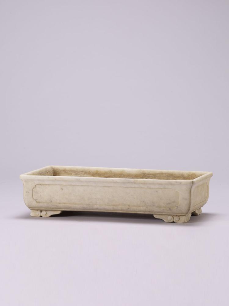 A FOUR-LEGGED SQUARE MARBLE BASIN