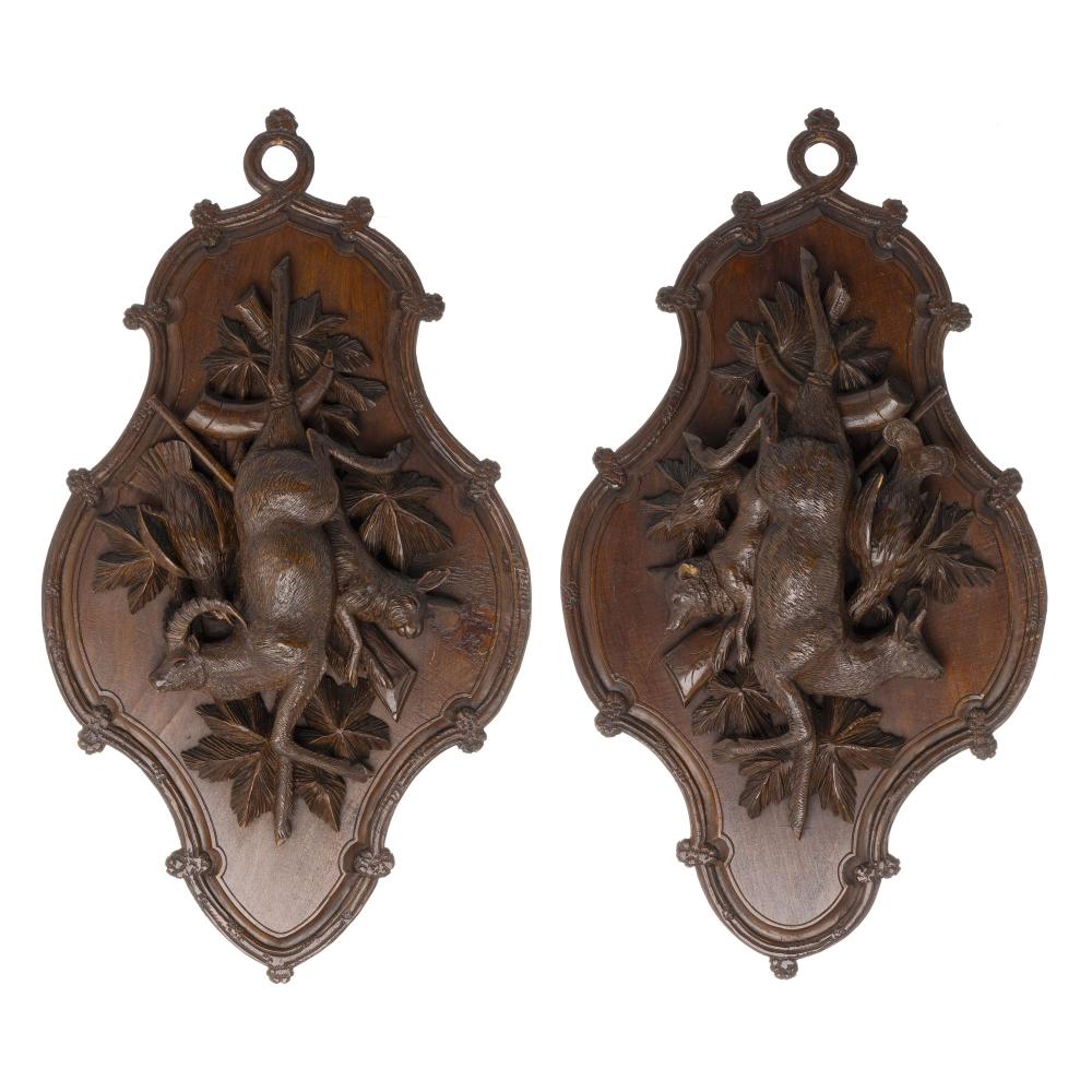 Pair of carved wood hunting plaques