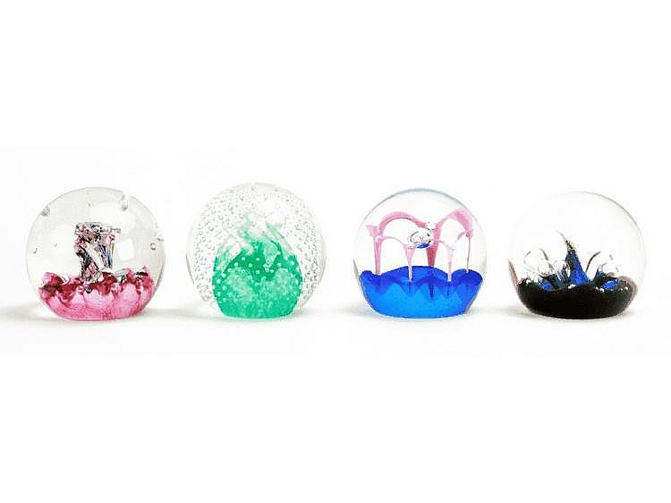 Eleven Caithness Glass paperweights, including