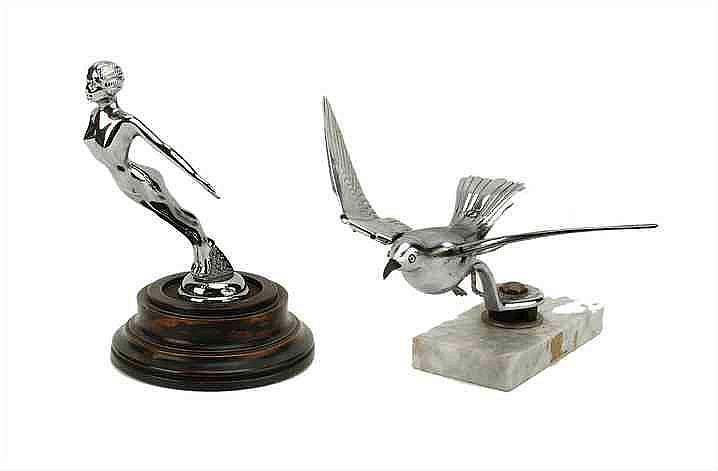 A Nesmo chromed car mascot depicting a diving