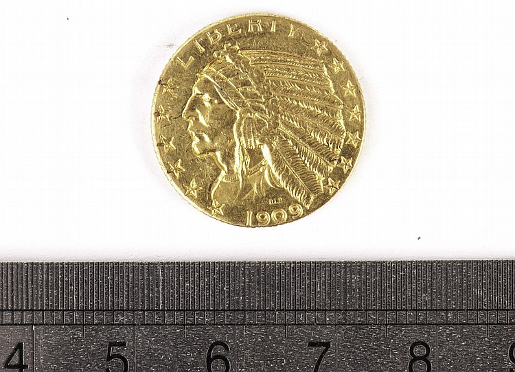 A US Five Dollar gold coin,