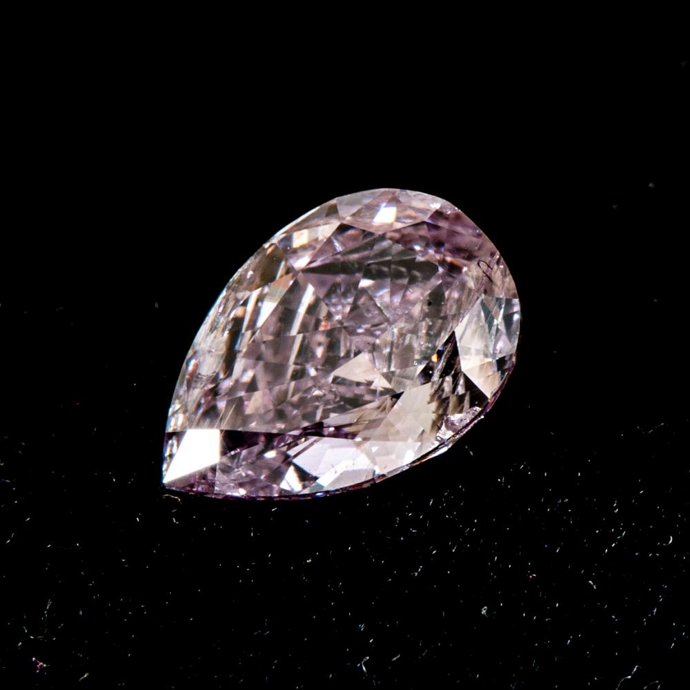 AN UNMOUNTED PEAR-CUT PINK DIAMOND