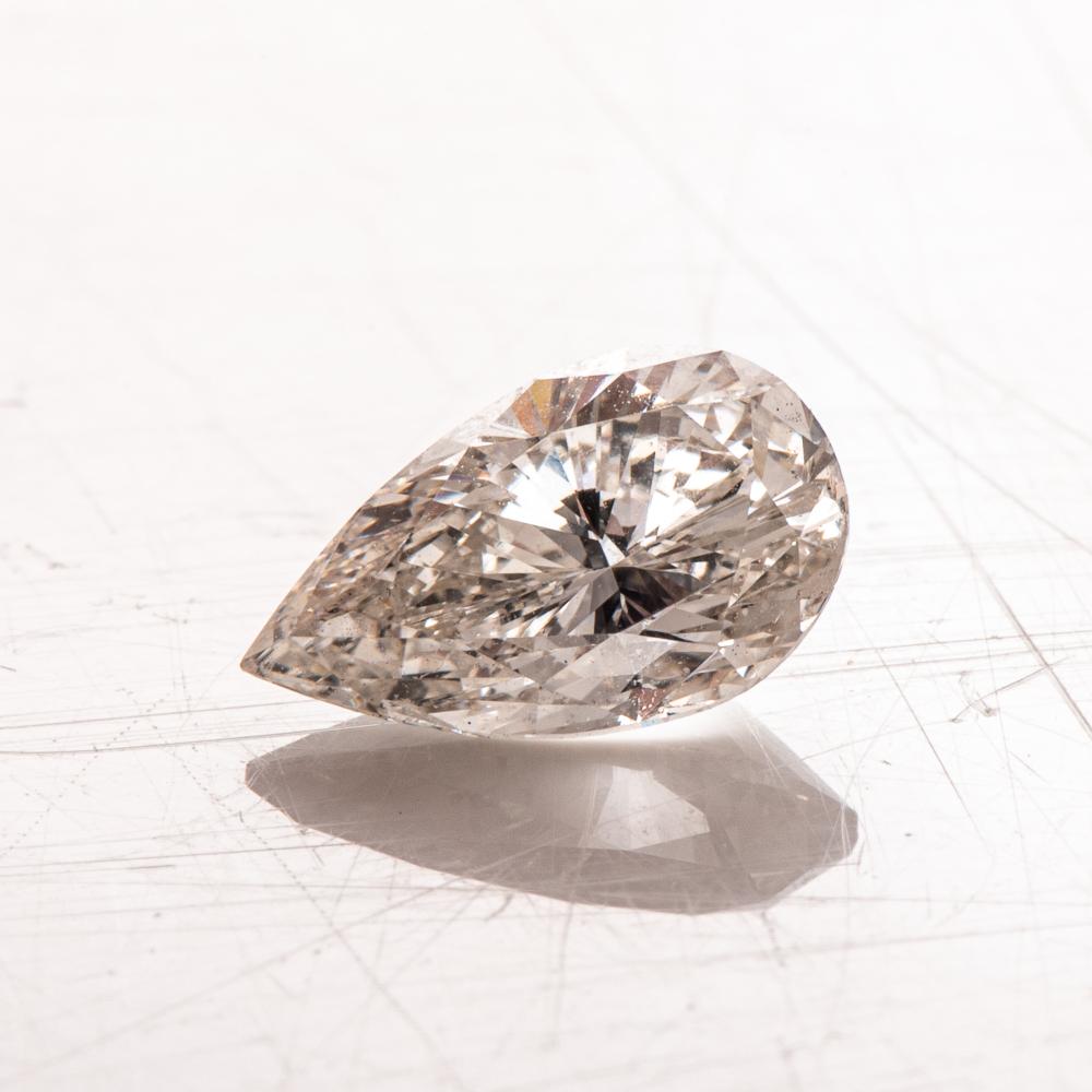 AN UNMOUNTED PEAR-CUT DIAMOND