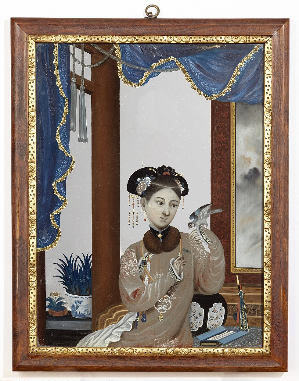 A Chinese Export Reverse Painted Glass Mirror