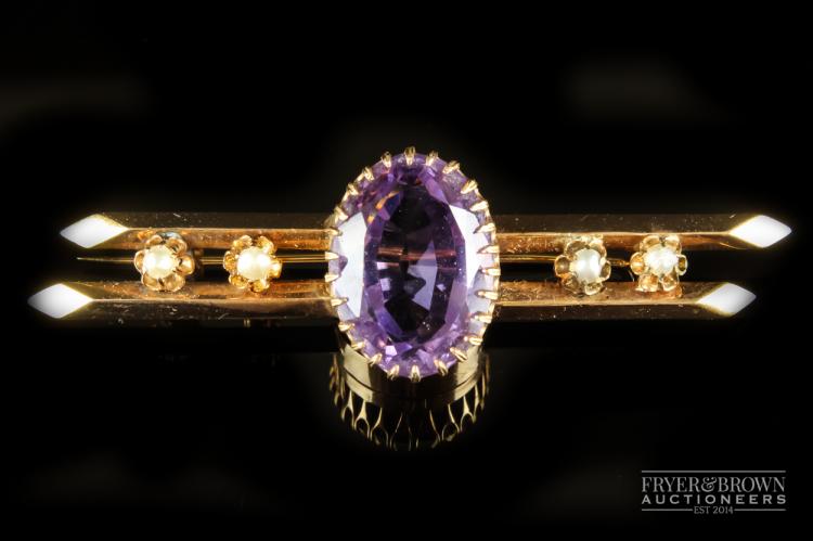 A Victorian amethyst and split pearl brooch