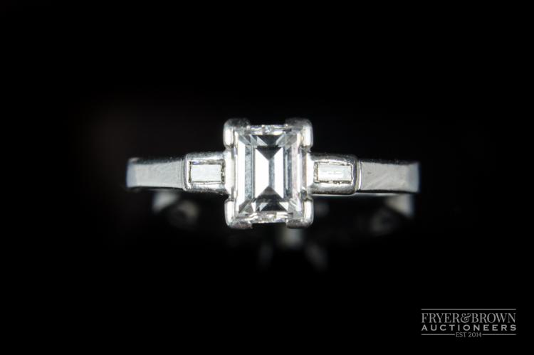 A fine Art Deco emerald cut diamond single stone ring