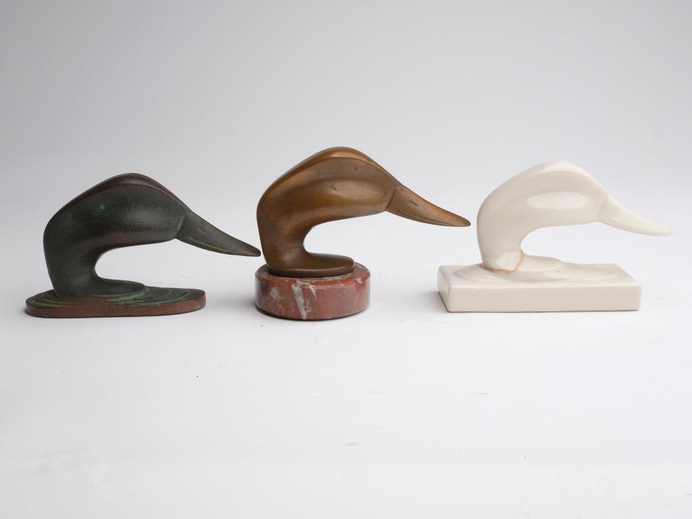 Three duck heads created by Joel Barber.