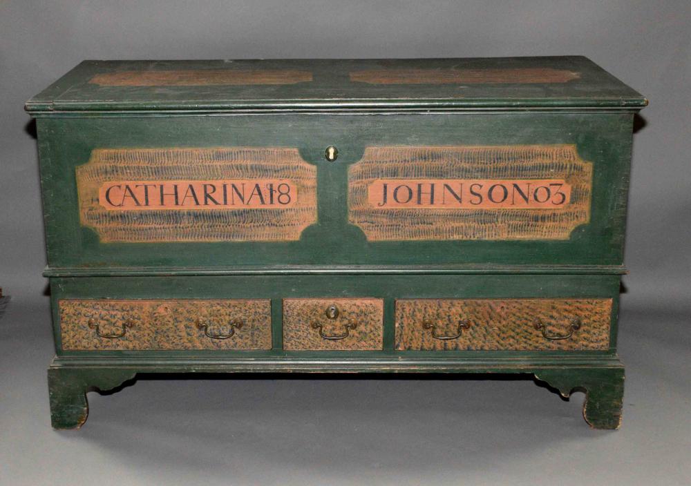 PENNSYLVANIA PAINT DECORATED DOWER CHEST, Catherina Johnson 1803 full dovetail single board construction with three drawers in the base. Bear trap lock, strap hinges, ogee bracket feet with original h