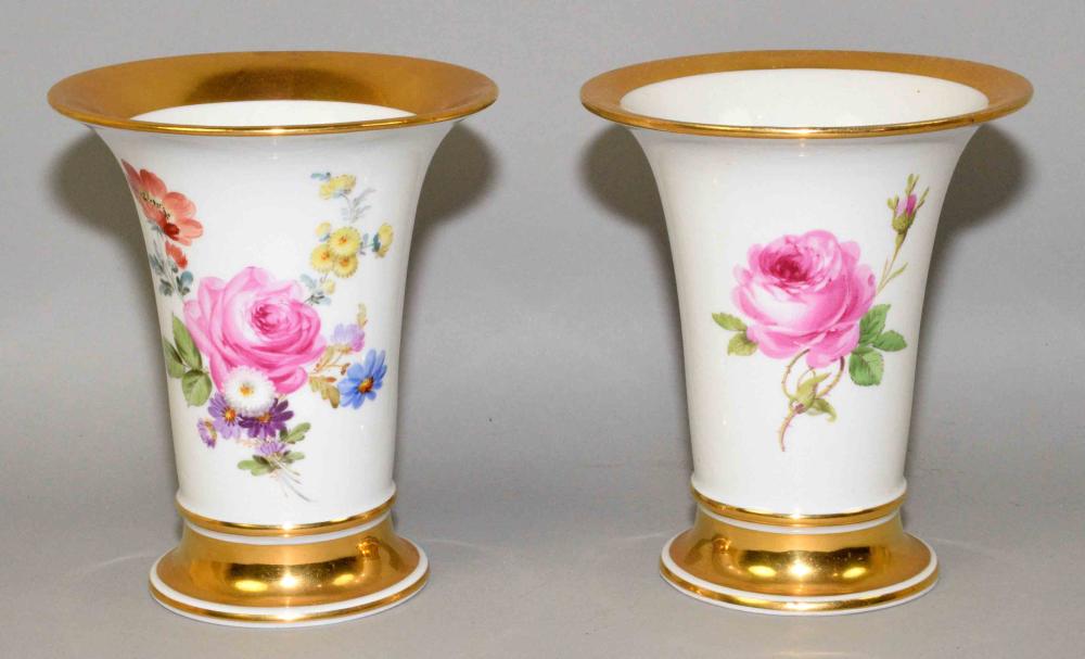 PAIR OF MEISSEN VASES. Each with its own floral and gold gilt decor, crossed blue sword mark. 6.75''H x 5.5'' diameter.