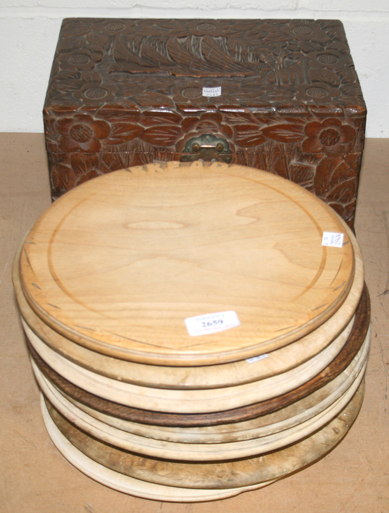 A GROUP OF NINE CARVED CIRCULAR BREADBOARDS AND A RECTANGULAR BREADBOARD