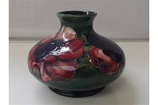 Moorcroft pottery vase, squat form, tube lined in the Anemone pattern, impr