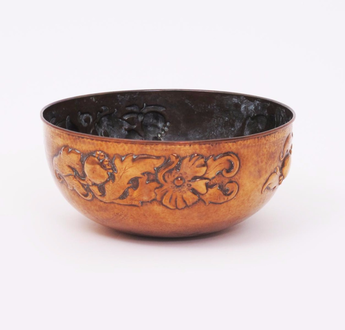 A large Newlyn Industrial Classes repousse hammered copper bowl