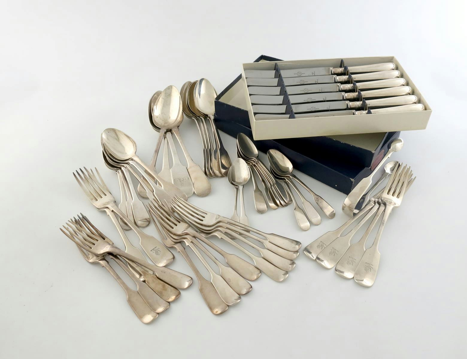 A mixed lot of antique Fiddle pattern flatware