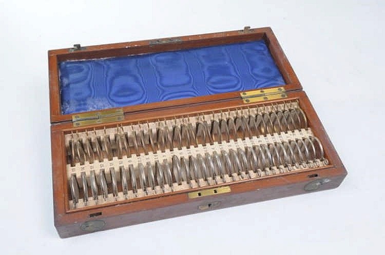 An Edwardian opticians set The hinged mahogany cas