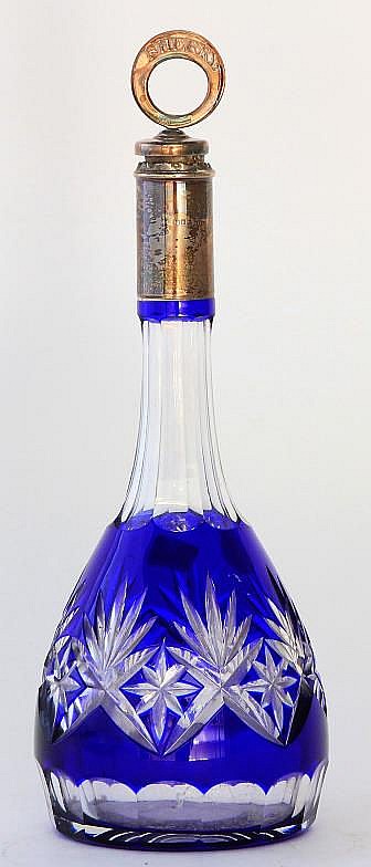 A silver topped Bohemian glass decanter The facete