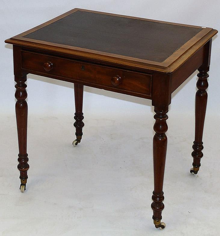 A Victorian mahogany writing table The rectangular