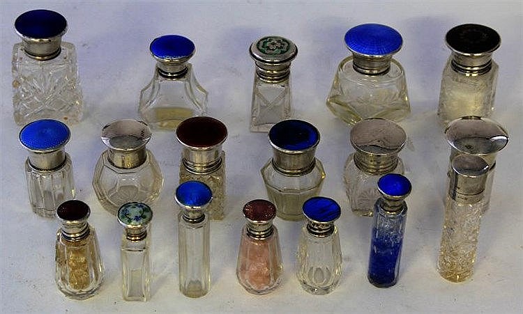 A collection of silver topped scent bottles Of var