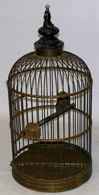 A Victorian style brass parrot cage Having a paint