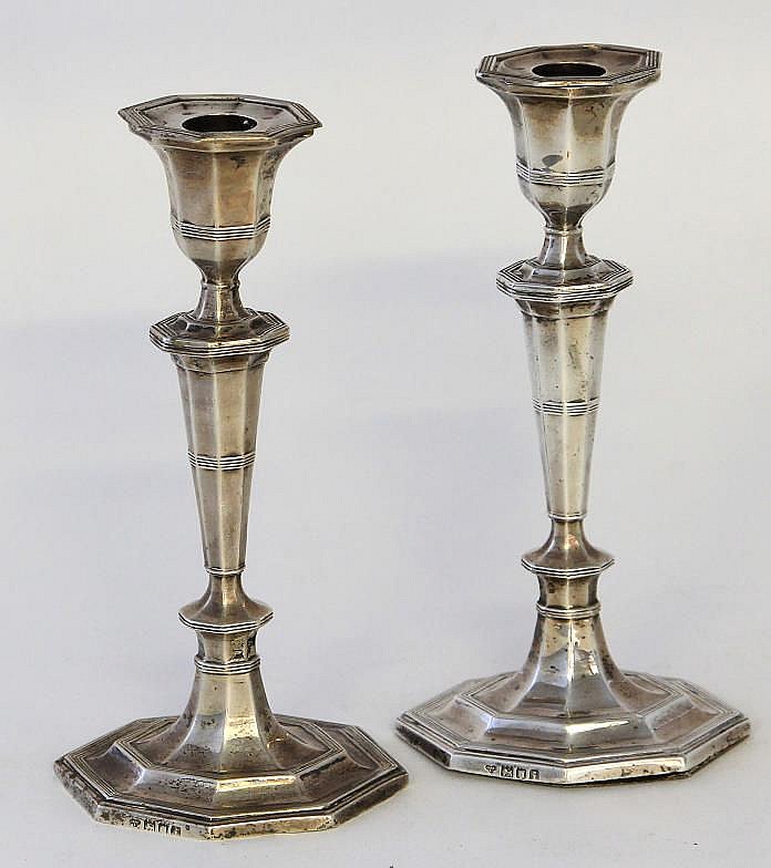 An Edwardian pair of silver candlesticks Of elonga