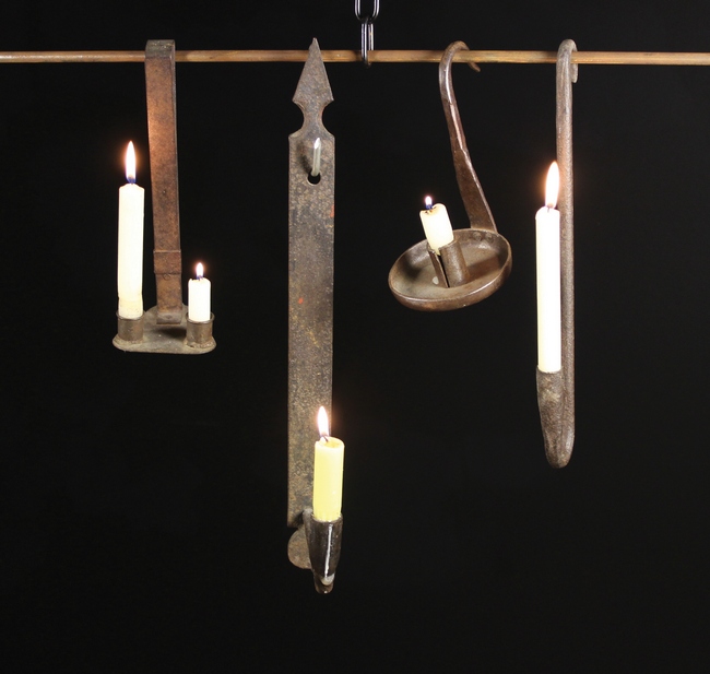 Four Iron Candle holders: An 18th century wrought iron pendant candle holder