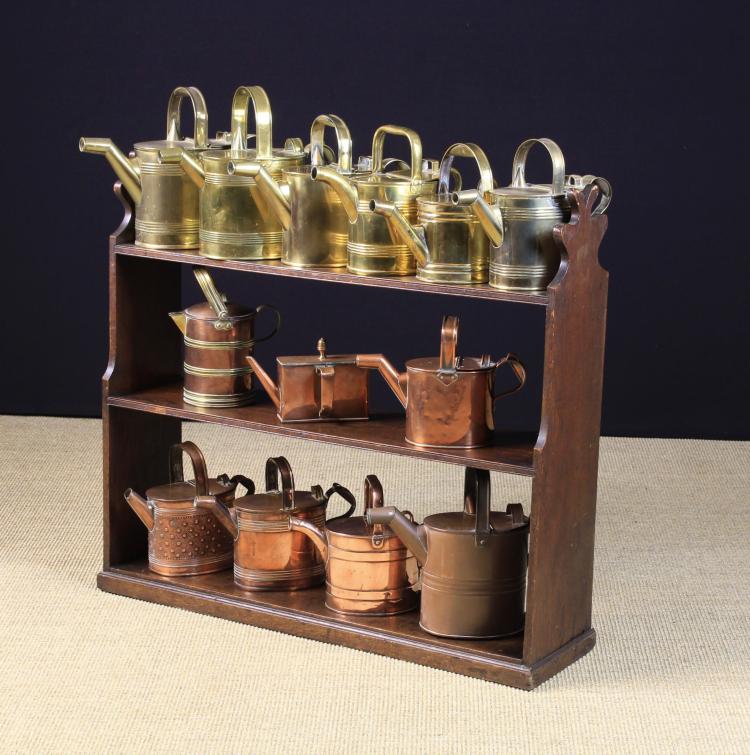 A Collection of Six Copper & Six Brass Watering Cans