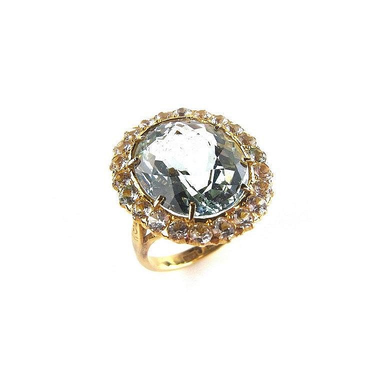 22 ct yellow gold aquamarine and sapphire ring. The oval cut aquamarine wei