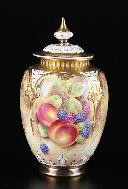 Royal Worcester: a covered vase painted with a