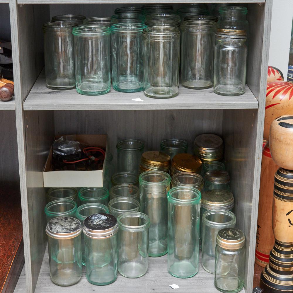 TWO SHELVES OF FOWLER'S PRESERVING JARS AND LIDS