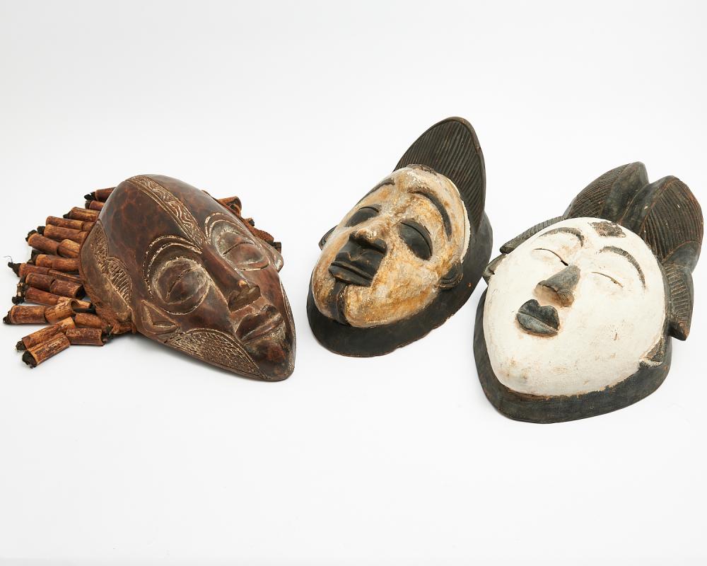 THREE AFRICAN CARVED MASKS