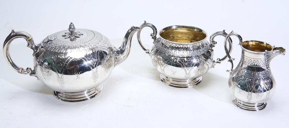 A VICTORIAN THREE PIECE STERLING SILVER TEA SET...
