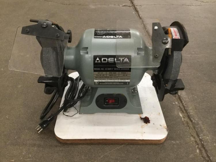 A Delta 1/4 H.P. 6 inch bench grinder w/ eye sheilds