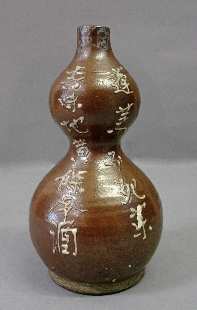 An Earthenware Double Gourd Vase: 19th century,