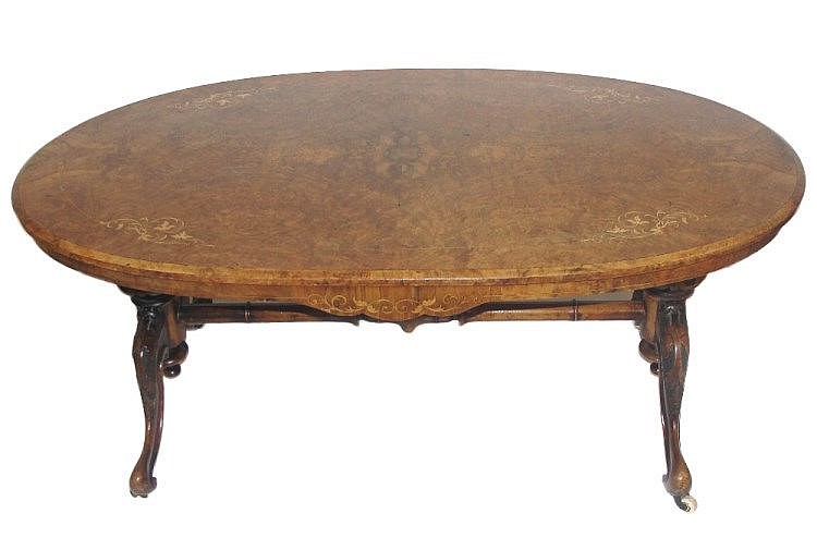 A Table: 19th century, burr walnut the oval top