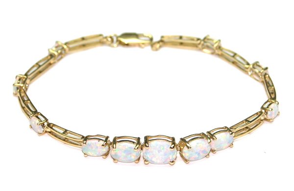 1498: 6,CT OPAL 7.40 GR 14KT  GOLD BRACELET .