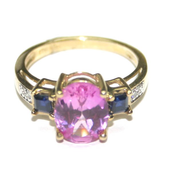 5017: 3,CT PINK TOPAZ & SAPPHIRE 10K GOLD RING .